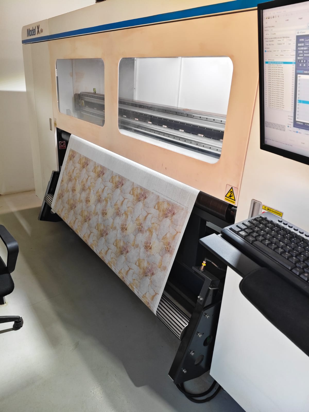 Digital fabric printer running a floral print